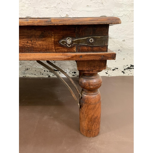 202 - An Indonesian hardwood rectangular coffee table - approx. 40cm high x 110cm long x 59cm wide