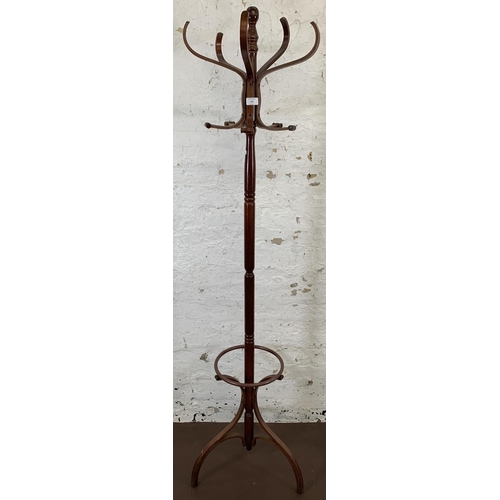 212 - A mahogany and bentwood freestanding five section coat stand - approx. 182cm high