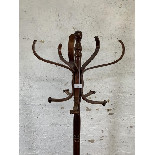 212 - A mahogany and bentwood freestanding five section coat stand - approx. 182cm high