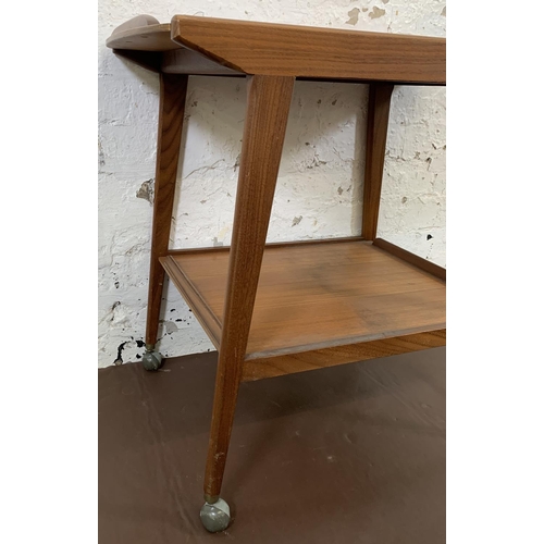 217 - A mid 20th century Remploy teak two tier drinks trolley - approx. 67cm high x 74cm long x 43.5cm wid... 