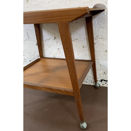 217 - A mid 20th century Remploy teak two tier drinks trolley - approx. 67cm high x 74cm long x 43.5cm wid... 