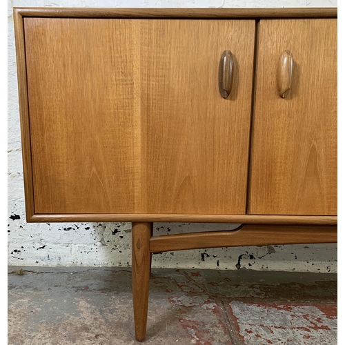 218 - A mid 20th century G Plan Brasilia teak sideboard - approx. 78.5cm high x 205.5cm long x 45.5cm deep