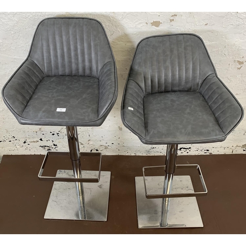 221 - A pair of modern Dunelm aluminium and grey vinyl height adjustable swivel bar stools - approx. 104cm... 