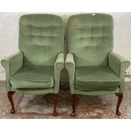 227 - A pair of vintage green fabric upholstered button back armchairs on cabriole supports - approx. 107c... 