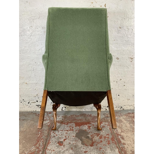 227 - A pair of vintage green fabric upholstered button back armchairs on cabriole supports - approx. 107c... 