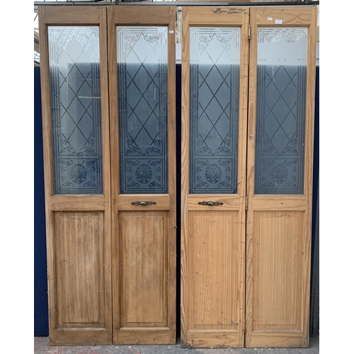 30 - A pair of pine and acid etched glazed bifold doors - each approx. 195cm high x 75cm wide