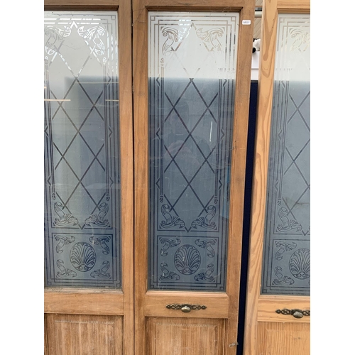 30 - A pair of pine and acid etched glazed bifold doors - each approx. 195cm high x 75cm wide