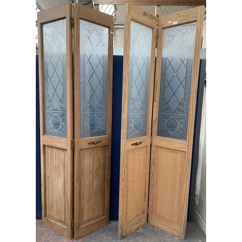 30 - A pair of pine and acid etched glazed bifold doors - each approx. 195cm high x 75cm wide