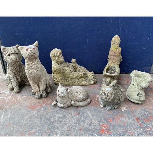 233 - Seven cast stone garden statues to include gnome, cat, rabbit etc. - largest approx. 37cm high