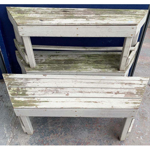 234 - Three matching painted pine garden benches - each approx. 46cm high x 127cm long x 34cm deep