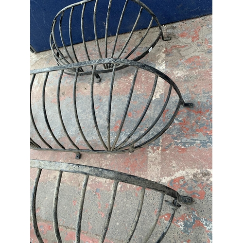 236 - Three cast metal and black painted wall hanging planters