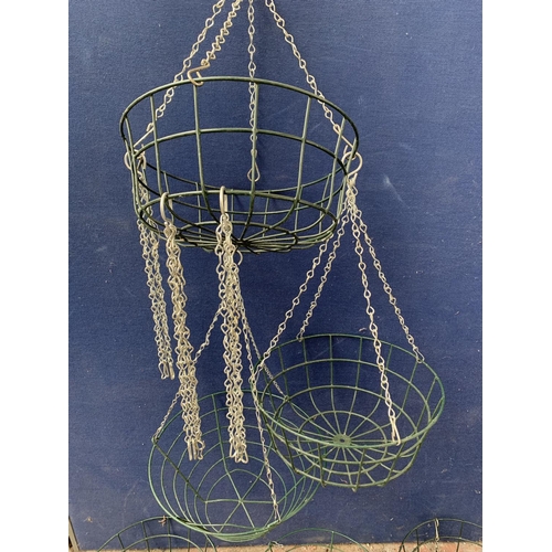 237 - A quantity of green painted metal hanging basket planters