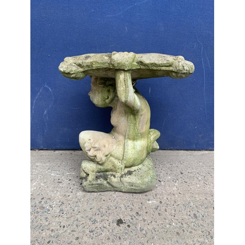 240 - A cast stone garden side table on cherub base - approx. 46cm high x 37cm wide