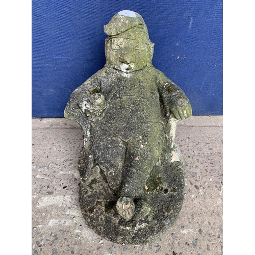 241 - A cast stone sleeping gnome garden statue - approx. 39cm high