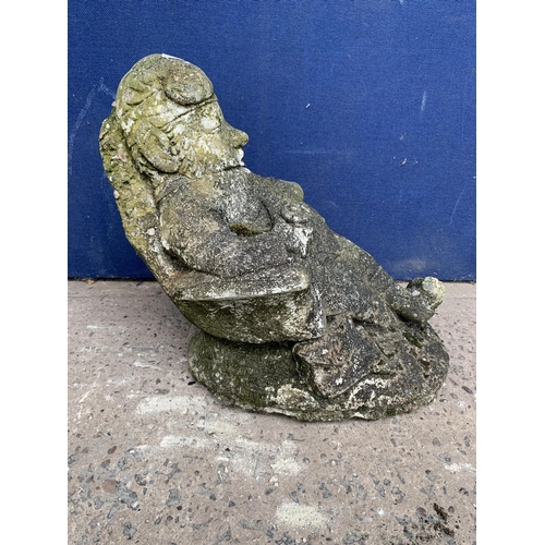 241 - A cast stone sleeping gnome garden statue - approx. 39cm high