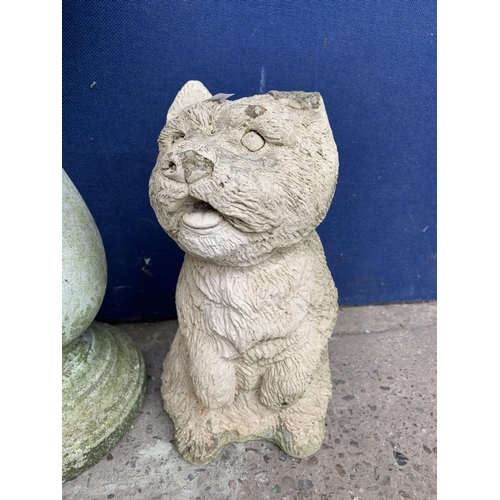 242 - Two cast stone garden accessories, one dog statue - approx. 33cm high and one birdbath - approx. 63c... 