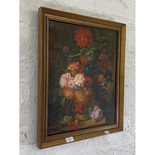 265 - A vintage framed oil on canvas of a still life floral scene - approx. 57cm high x 47cm wide