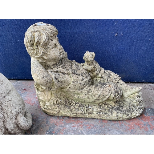 233 - Seven cast stone garden statues to include gnome, cat, rabbit etc. - largest approx. 37cm high