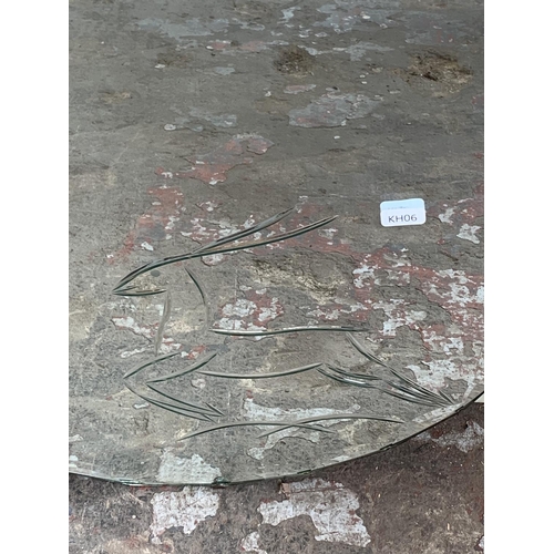 247 - A mid 20th century circular bevelled edge wall mirror with etched deer design - approx. 50cm in diam... 