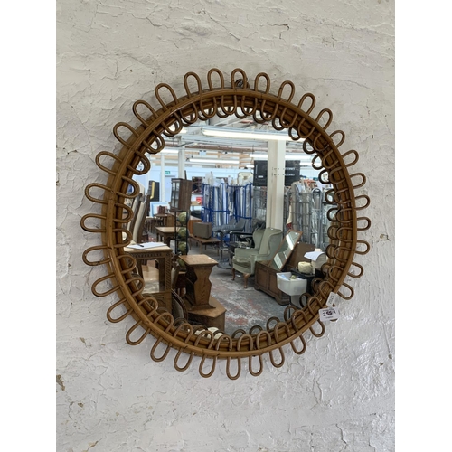 255A - A mid 20th century circular bamboo framed bohemian wall mirror - approx. 50cm in diameter