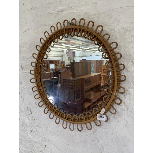 255A - A mid 20th century circular bamboo framed bohemian wall mirror - approx. 50cm in diameter