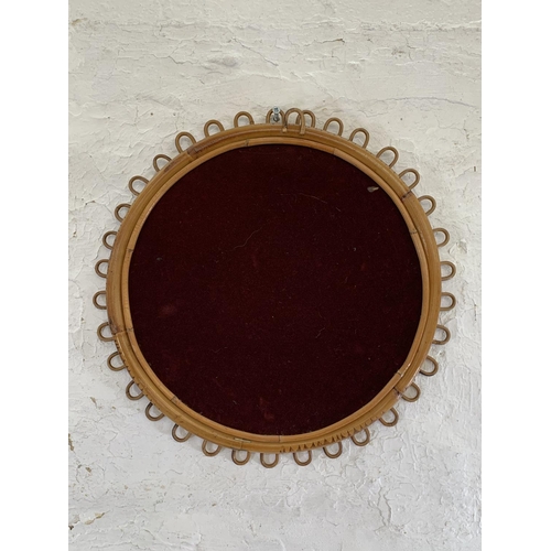 255A - A mid 20th century circular bamboo framed bohemian wall mirror - approx. 50cm in diameter