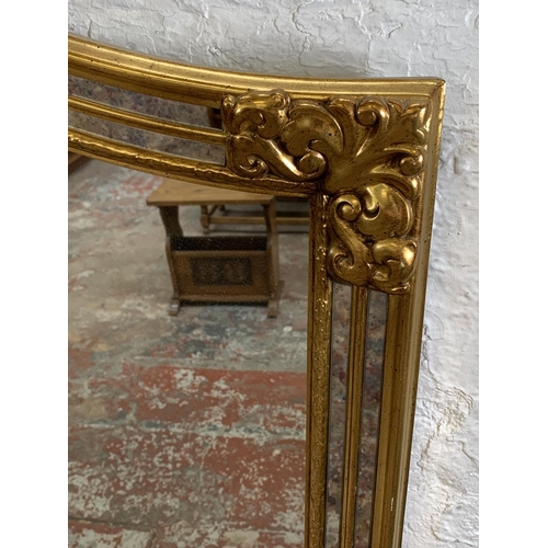 256 - A modern gilt framed French style overmantle mirror - approx. 90cm high x 130cm wide