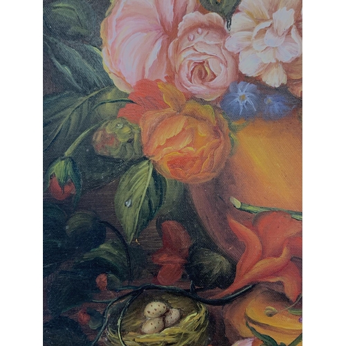 265 - A vintage framed oil on canvas of a still life floral scene - approx. 57cm high x 47cm wide