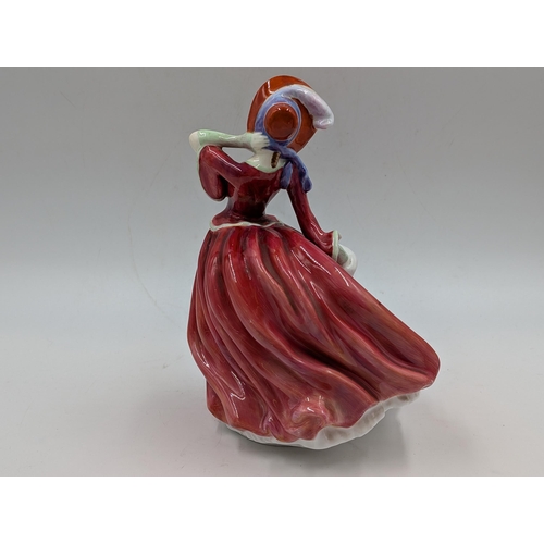 404 - Three Royal Doulton figurines, Autumn Breezes, Karen HN2388 and Lynne HN2329