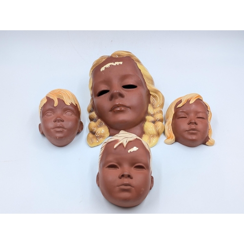 419 - Four 1960s West German Cortendorf pottery wall masks - largest approx. 20cm high x 14cm wide