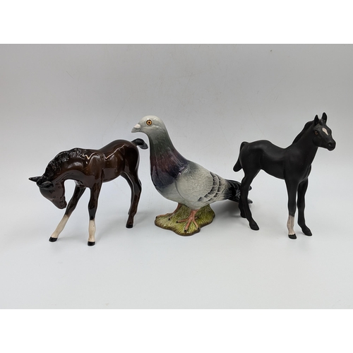 421 - Eight Beswick ceramic animal figurines to include Pigeon model no. 1383, Nuthatch model no. 2413, Do... 