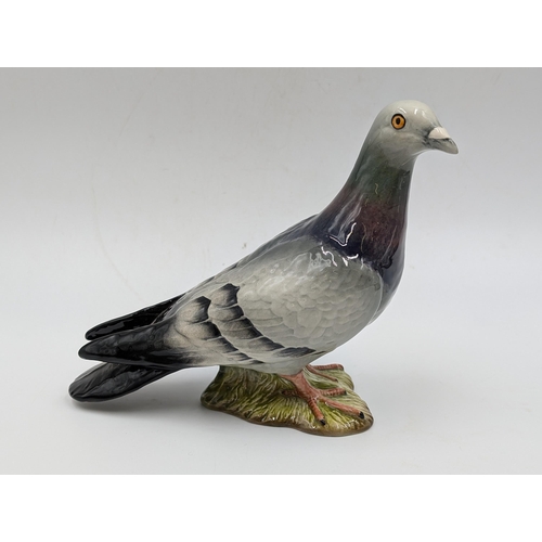 421 - Eight Beswick ceramic animal figurines to include Pigeon model no. 1383, Nuthatch model no. 2413, Do... 