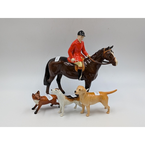 428 - Four Beswick figurines, Huntsman and Horse, Hound, Fox and Labrador - largest approx. 21.5cm high x ... 