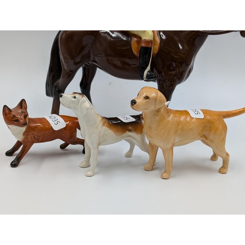 428 - Four Beswick figurines, Huntsman and Horse, Hound, Fox and Labrador - largest approx. 21.5cm high x ... 