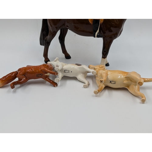 428 - Four Beswick figurines, Huntsman and Horse, Hound, Fox and Labrador - largest approx. 21.5cm high x ... 