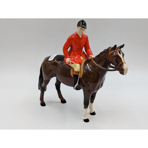 428 - Four Beswick figurines, Huntsman and Horse, Hound, Fox and Labrador - largest approx. 21.5cm high x ... 