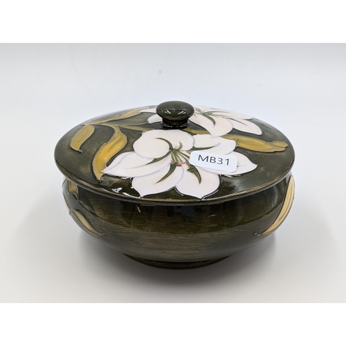 442 - A Moorcroft Pottery Bermuda Lily circular footed trinket box - approx. 7cm high x 13cm diameter