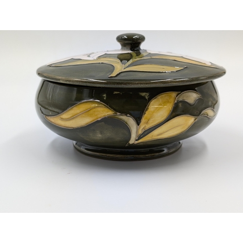 442 - A Moorcroft Pottery Bermuda Lily circular footed trinket box - approx. 7cm high x 13cm diameter