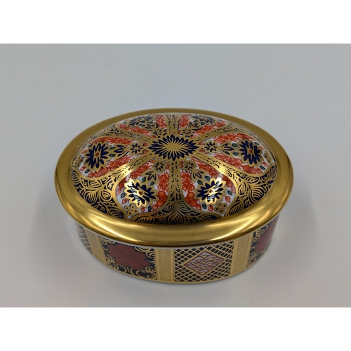 453 - A Royal Crown Derby Old Imari oval trinket box - pattern no. 1128 - approx. 5cm high x 8cm long x 6c... 