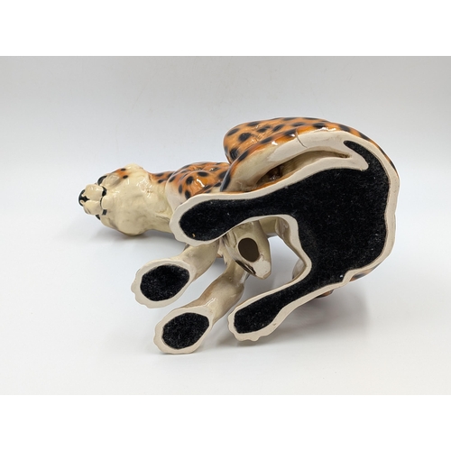 458 - Two ceramic seated cheetah figurines - each approx. 24.5cm high