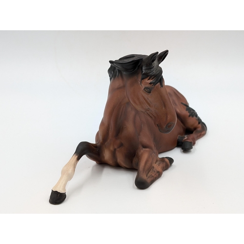 459 - A Beswick matte finish figure of a seated bay horse