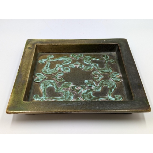 462 - A mid 20th century Keramikos Poole studio pottery square dish, signed to reverse 'J M. Potts' - appr... 