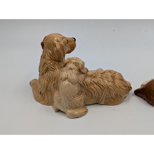 463 - Two Royal Doulton ceramic dog figurines, one Cocker Spaniel with Puppy - DA174 and one Golden Retrie... 