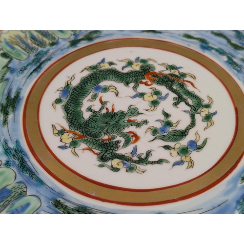 467 - An Oriental hand painted circular wall charger with six character mark to reverse - approx. 36.5cm i... 