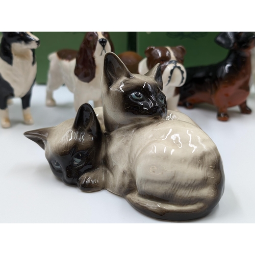 477 - Seven Beswick animal figurines to include bulldog, Dachshund, Dalmatian, Sheepdog, Siamese Cats etc.