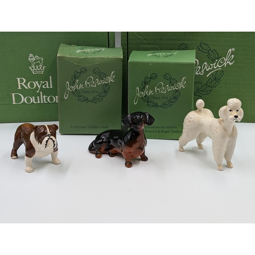 477 - Seven Beswick animal figurines to include bulldog, Dachshund, Dalmatian, Sheepdog, Siamese Cats etc.