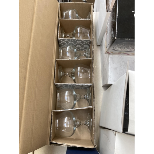 493 - A collection of boxed glassware to include Royal Doulton cut crystal and acid etched 22cm vase, Bohe... 