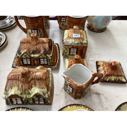 496 - Approx. twenty two pieces of Price Kensington Cottage ware together with a Price Kensington hand pai... 