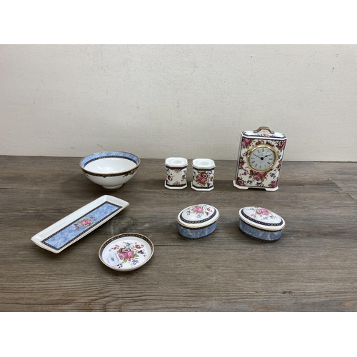 499 - Eight pieces of Royal Doulton Centennial Rose fine bone china comprising two oval trinket boxes, one... 