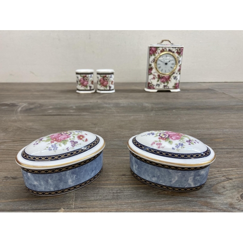 499 - Eight pieces of Royal Doulton Centennial Rose fine bone china comprising two oval trinket boxes, one... 